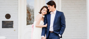 beautiful bride in white strapless lace midi wedding rehearsal dress barbie pink bow sash with groom engagement photo