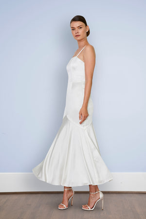 Bride twirling in backless off white midi mermaid wedding dress