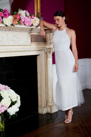 elegant modern bride dress in shimmering champagne designer sequin fabric mantle with flowers  