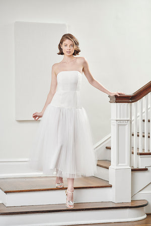 elegant bride wearing strapless flattering tea length midi bustier fun romantic tulle wedding dress and after party dress